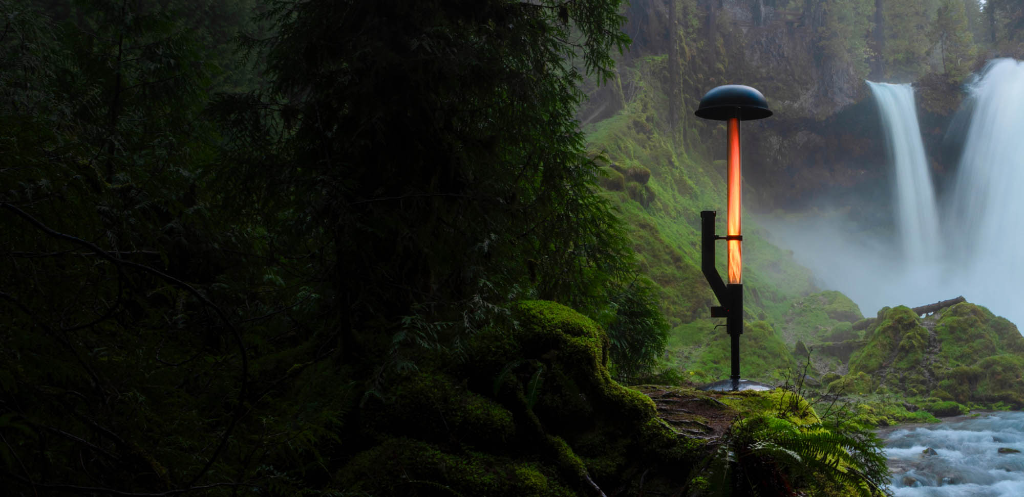 Patiofyre Jetlamp set by a cascading waterfall